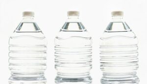 A row of three plastic water bottles